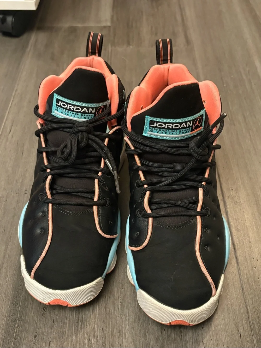 Jordan Black Sneakers with Coral Trim and Teal Logo Patch